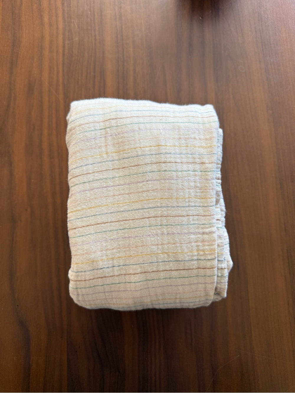 Mushie Muslin Crib Fitted Sheet with Subtle Rainbow Stripes